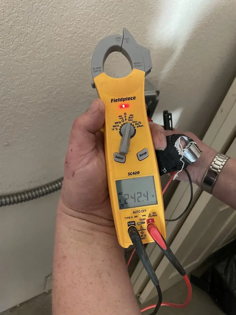 Voltage testing with clamp meter during Circuit Breaker Repair in Brentwood